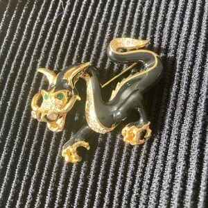 Elegant, vintage dragon brooch.  Gold detail, crystals and emerald colored eyes.